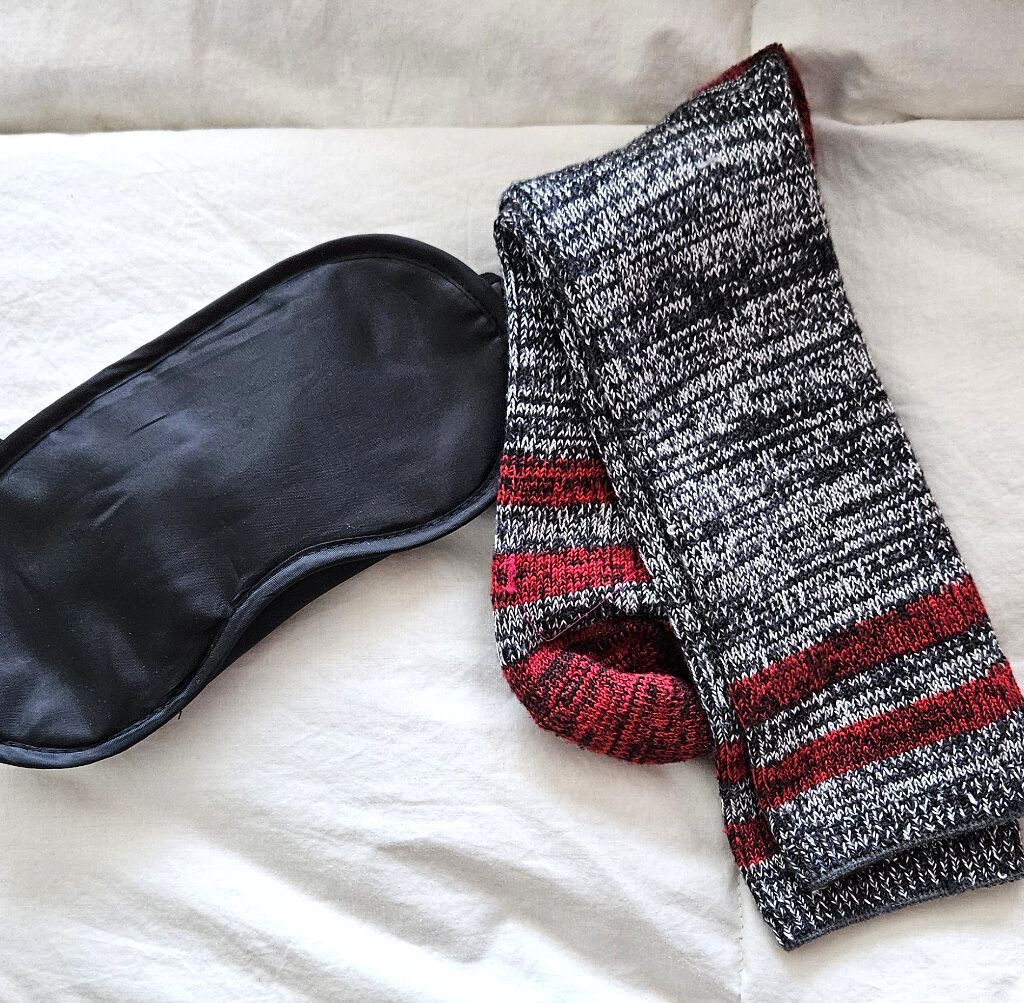 Things You Should Pack in Your Carry-on Bag mask and sock